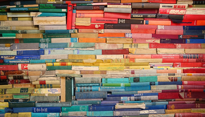 Multiple colorful books can be seen in this representational image. — Unsplash
