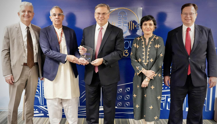 Executive Director IBA Dr. S Akbar Zaidi presents the shield to the U.S. Ambassador to Pakistan, Donald Blome at the Institute of Business Administration (IBA) on January 24, 2024. — Facebook/IBA - Institute of Business Administration