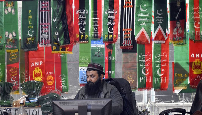 A vendor displaying political parties flags attraction for customers in his shop in the Provincial Capital, ahead of the countrys general elections 2024 on January 23, 2024. — Online