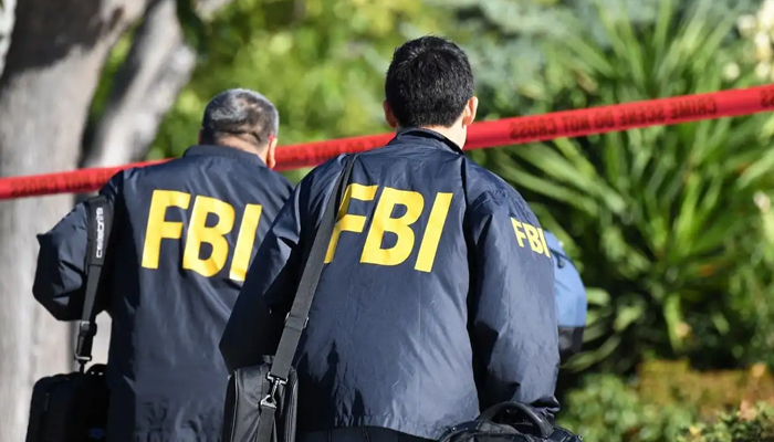 FBI investigators can be seen in this image. — AFP/File