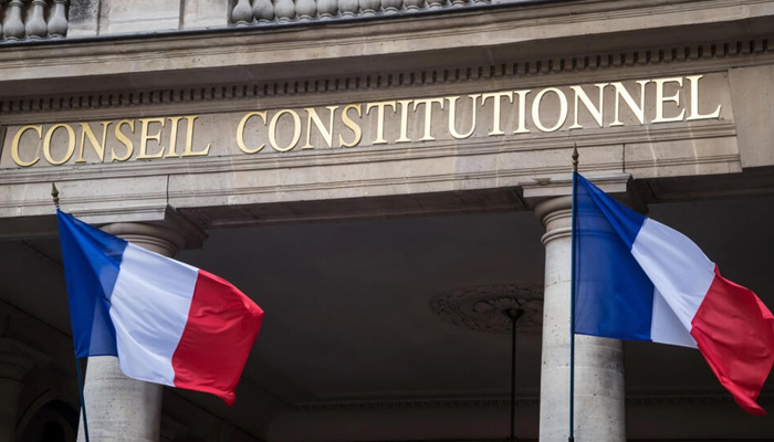 This photo shows French flags outside the headquarters of the French Constitutional Council in Paris. — AFP/File