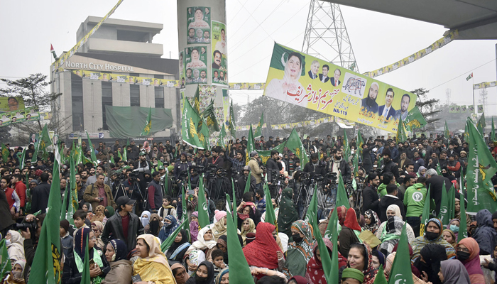 Supporters of Pakistan Muslim League (N) hold party flags during the inauguration of election campaign camp office of senior vice president of the PML-N Maryam Nawaz, at Singhpura in Lahore on January 25, 2024. — Online