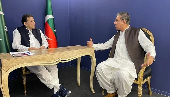 This picture released on June 7, 2023, shows former foreign minister Shah Mahmood Qureshi speaking with former premier Imran Khan. — Facebook/Imran Khan