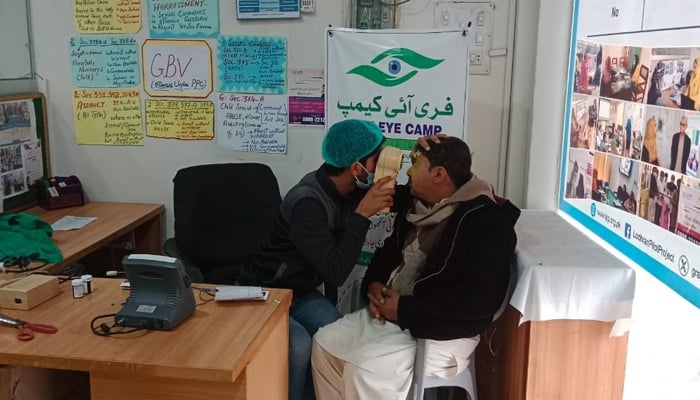 A healthcare expert can be seen checking a patient during a free medical camp on January 26, 2024. — Facebook/Jahangir Khan Tareen