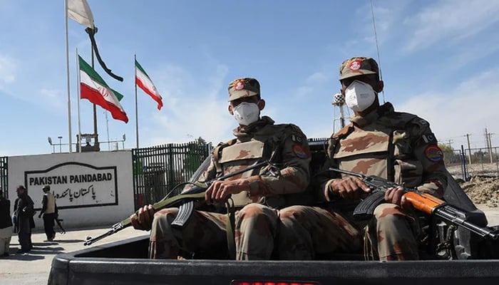 Pakistani soldiers wearing facemasks patrol near the closed Pakistan-Iran border in Taftan. — AFP/File