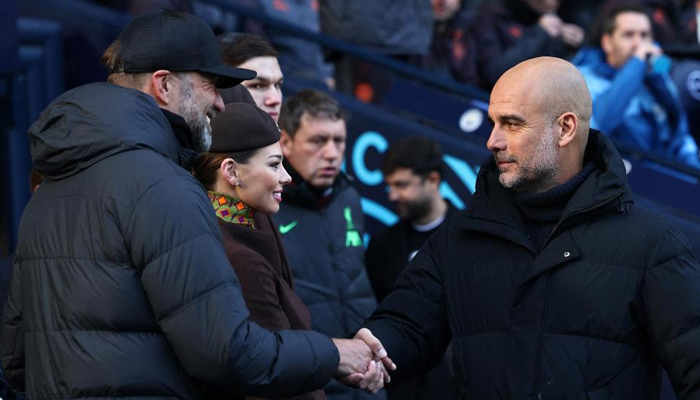 Jurgen Klopp (left) along with Pep Guardiola can be seen in this image. — AFP/File