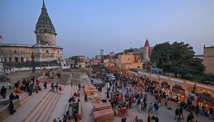 Hindu devotees walk towards the newly inaugurated temple of Hindu deity Ram in Ayodhya on January 23, 2024. — AFP
