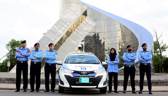 Islamabad Capital City Police Officers pose near the smart car on January 27, 2024. — Facebook/Islamabad Police
