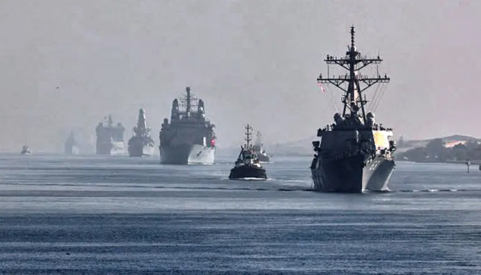 This image shows a view of the vessels of the strike group sailing behind the Royal Navys HMS Queen Elizabeth aircraft carrier through Egypts Suez Canal. — AFP/File