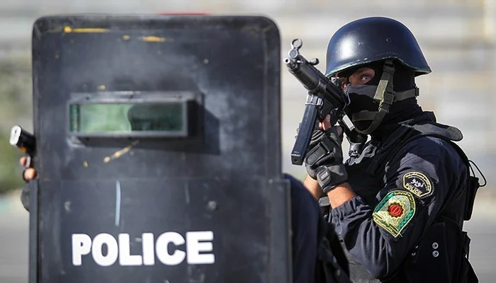 An Iranian police official can be seen during a drill. — IRNA/File