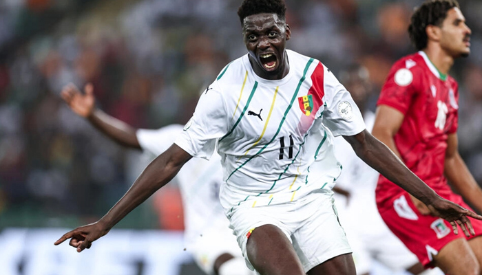 Mohamed Bayo celebrates scoring his team´s first goal during the Africa Cup of Nations (CAN) 2024 round of 16 football match between Equatorial Guinea and Guinea at the Alassane Ouattara Stadium in Ebimpe, Abidjan, on January 28, 2024. — AFP