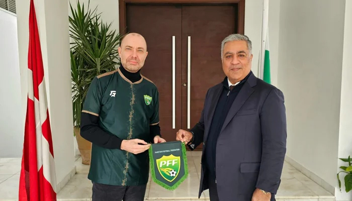 Haroon Malik (R) with Denmark Ambassador to Pakistan H.E. Jakob Linulf. — PFF