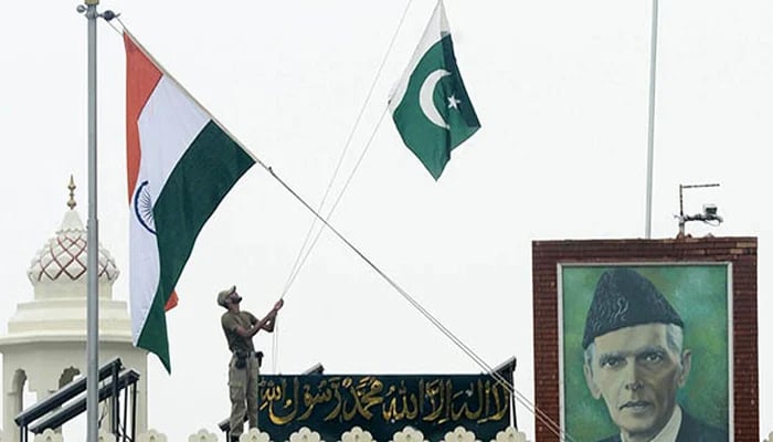This image shows Pakistan (R) and Indian flags. — AFP/File