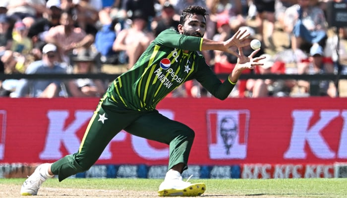 Pakistans Usama Mir catches the ball to dismiss New Zealands Mitchell Santner during the fifth and final Twenty20 international cricket match between New Zealand and Pakistan at Hagley Oval in Christchurch on January 21, 2024. — AFP