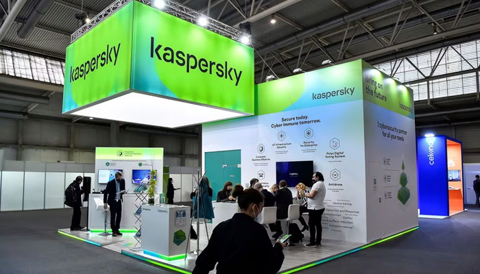 Visitors sit at the stand of Russian antivirus software development company Kaspersky Lab. — AFP/File
