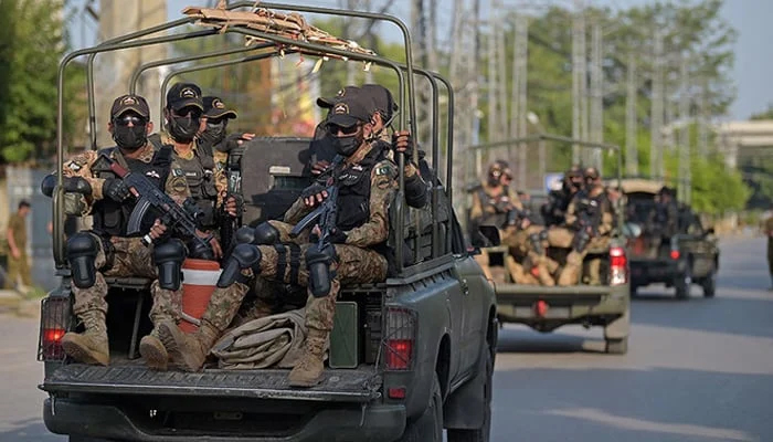 Pakistans army commandos depart in their vehicles after escorting a high-profile convoy in Rawalpindi on September 13, 2021. — AFP