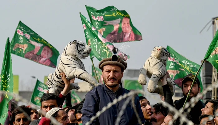 Supporters of Pakistan Muslim League Nawaz party attend an election campaign rally of party leader and Pakistans former Prime Minister Nawaz Sharif at Mansehra in Khyber Pakhtunkhwa province on January 22, 2024. — AFP