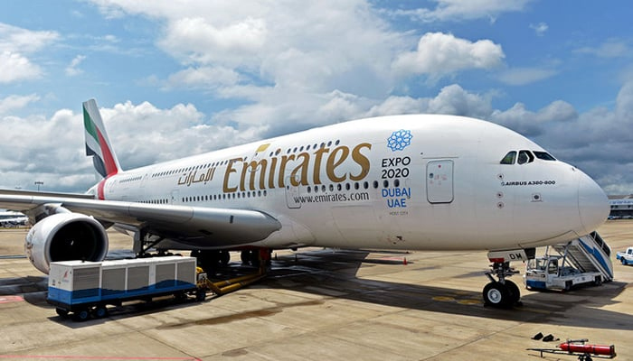 Emirates Airlines plane can be seen parked. — AFP/File