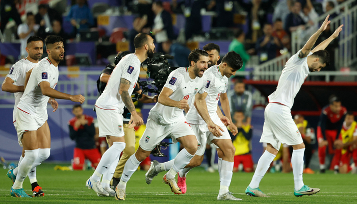 Irans players celebrate their win at the end of the Qatar 2023 AFC Asian Cup football match between Iran and Syria at the Abdullah bin Khalifa Stadium in Doha on January 31, 2024. — AFP