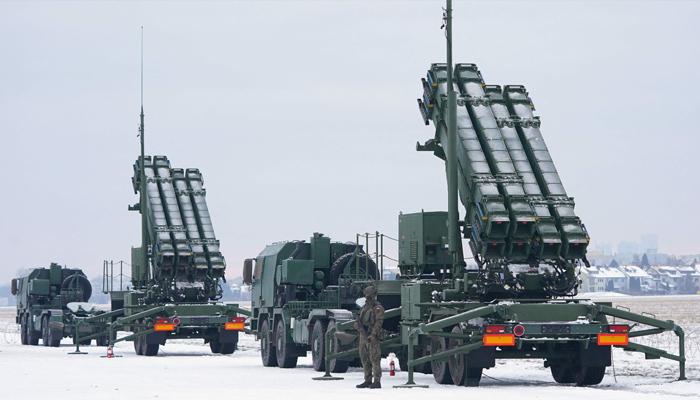 A soldier stands in front of Patriot surface-to-air missile systems during a military exercise at Warsaw Babice Airport, Poland on February 7, 2023. — AFP