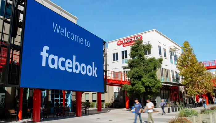 A giant digital sign of Facebook can be seen in Menlo Park, California, on October 23, 2019. — AFP