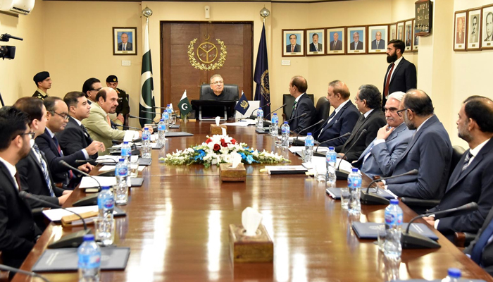 President Dr Arif Alvi listens at a meeting during his visit to the Office of Auditor General of Pakistan on February 1, 2024. — PID