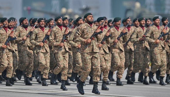 Pakistans army soldiers march during a military parade to mark Pakistans National Day in Islamabad. — AFP/File