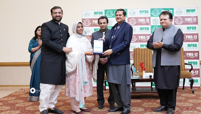 In this image, Punjab Education Minister Mansoor Qadir can be seen distributing shields to an officer on completion of the training course from the Management and Professional Development Department on February 2, 2024. — Facebook/Adil Riaz Gondal