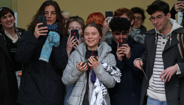 Swedish environmental activist Greta Thunberg (C) fellow defendants and supporters leave Westminster Magistrates Court in London on February 2, 2024, on the second day of their public order offence trial. — AFP