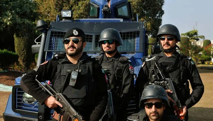 Police personnel stand guard in this image. — KP Police