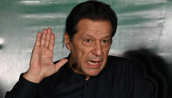 Former Pakistans Prime Minister Imran Khan speaks to media representatives at his residence in Lahore on May 18, 2023. — AFP