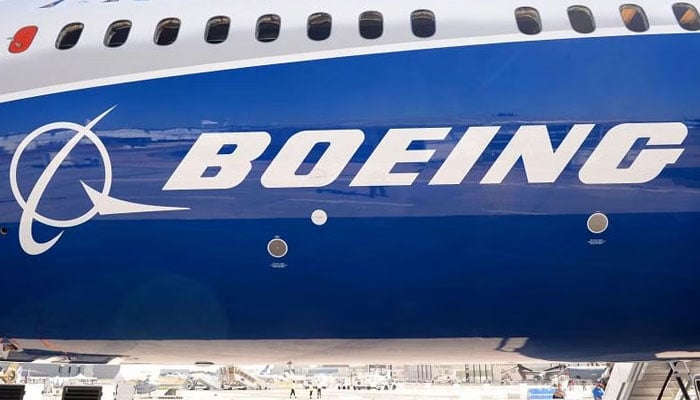A 2017 photo shows the Boeing logo on the fuselage of a Boeing 787-10 Dreamliner test plane. — AFP