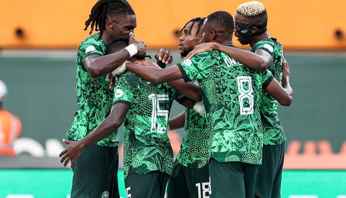 Nigerian players celebrate after Ademola Lookman put them ahead against Angola. —  AFP