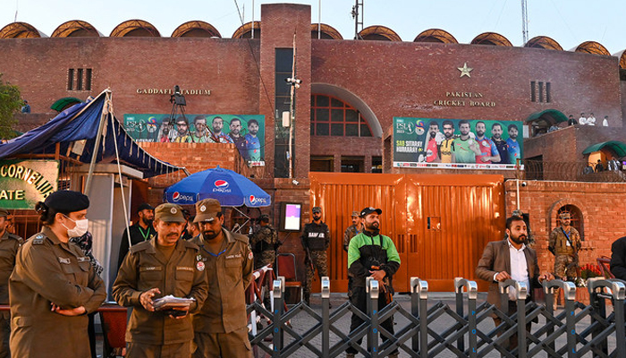 Policemen stand guard outside the Gaddafi Cricket Stadium during the Pakistan Super League (PSL) Twenty20 cricket final match between Multan Sultans and Lahore Qalandars, in Lahore on March 18, 2023. — AFP