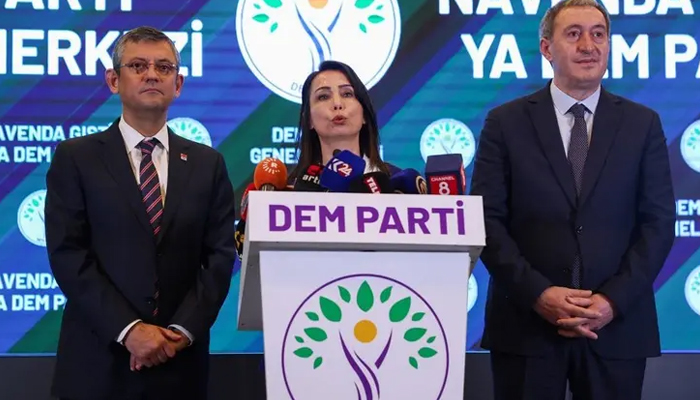 People’s Equality and Democracy Party (DEM) co-chairperson Tulay Hatimogullari (C) addresses a speech to the press next to Republican People’s Party Chairman (CHP) Ozgur Ozel (L) and People’s Equality and Democracy Party (DEM) co-chairperson Tuncer Bakirhan (R) after a meeting at DEM party headquarters in Ankara on December 13, 2023. — AFP