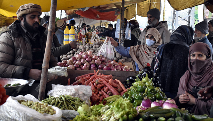 People are busy buying vegetables at Shadman Sundays weekly bazaar in Lahore on January February 4, 2024. — Online