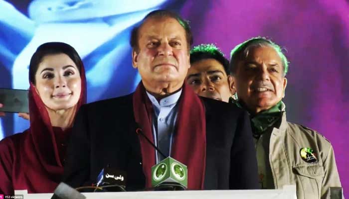 PML-N leaders Maryam Nawaz, Nawaz Sharif, and Shehbaz Sharif at the stage during a rally at Minar-e-Pakistan in Lahore, on October 21, 2023, in this still taken from a video. — X@pmln_org