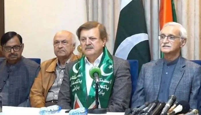 Humayun Akhtar Khan (centre) addressing a press conference in Lahore on Saturday, December 16, 2023. — IPP