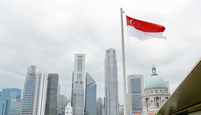 The Singaporean flag can be seen fluttering in this image. — AFP/File