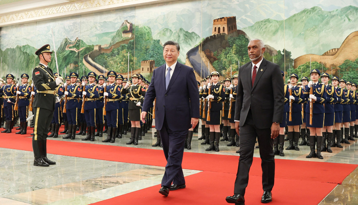 The photo on January 10, 2024 shows Maldives President Mohamed Muizzu (R) and Chinese President Xi Jinping walking during a welcome ceremony at the Great Hall of the People in Beijing. — AFP