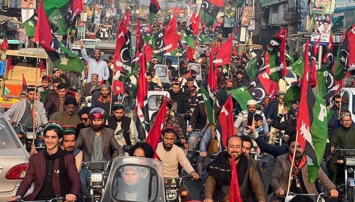 Pakistan Peoples Party (PPP) workers carrying party flags during an election rally. — X/@PPP_Org/File