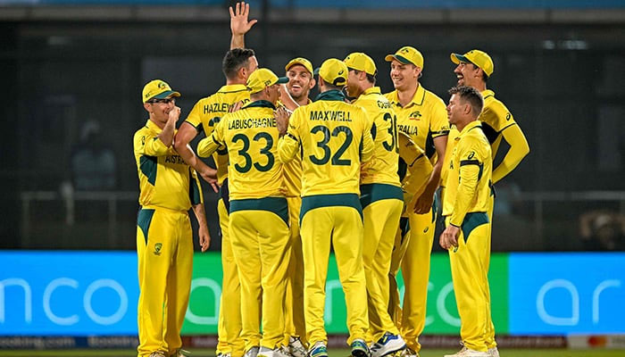 Australias players celebrate after the dismissal of Netherlands´ Colin Ackermann during the 2023 ICC Men´s Cricket World Cup one-day international (ODI) match between Australia and Netherlands at the Arun Jaitley Stadium in New Delhi on October 25, 2023. — AFP