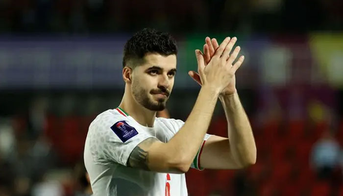 Irans midfielder Saeid Ezatolahi applauds the fans at the end of the Qatar 2023 AFC Asian Cup football match. — AFP/File
