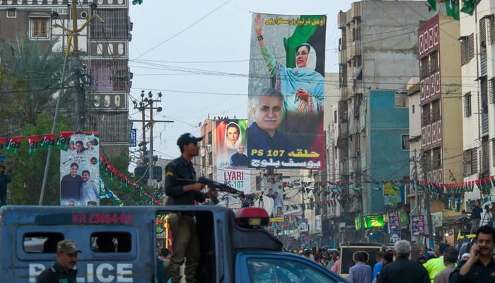 A policeman stands guard at the Pakistan Peoples Partys election campaign rally in Karachi on February 5, 2024, ahead of the national elections. — AFP