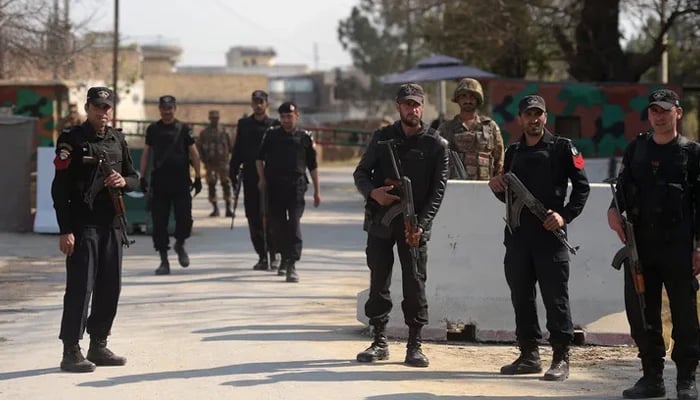 KPK soldiers and policemen stand guard outside the Haripur central jail in Mardan. — AFP/File
