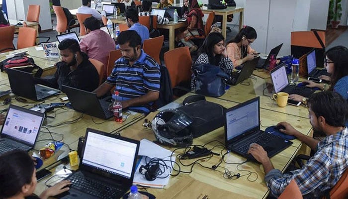 Employees of an online marketplace company in Karachi. — AFP/File