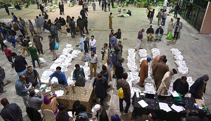 Presiding officers receiving ballot material on the eve of General Elections 2024 at Expo Center a day before Pakistan’s General Elections 2024 on February 07, 2024. — APP