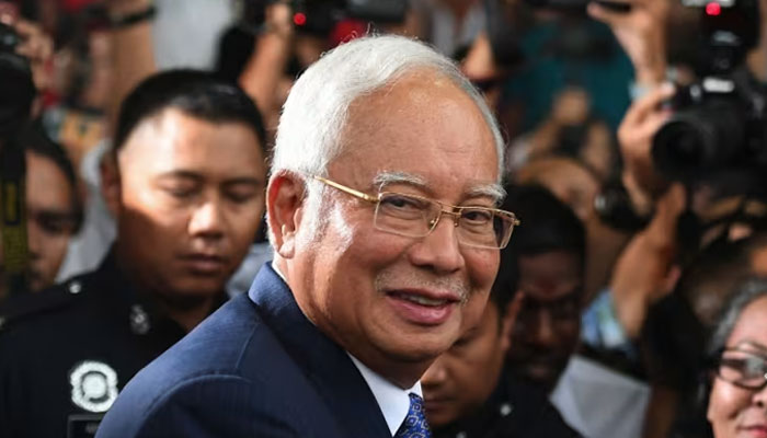 Malaysias former prime minister Najib Razak leaves a court in Kuala Lumpur, after facing his trial over alleged involvement in the looting of sovereign wealth fund on April 3, 2019. — AFP