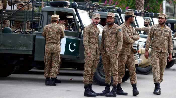 Law enforcers secure polling stations, conduct joint flag march
