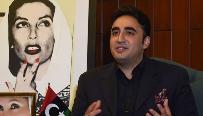 Pakistan Peoples Party (PPP) Chairman Bilawal Bhutto Zardari can be seen with a picture of his mother, late Benazir Bhutto. — AFP/File
